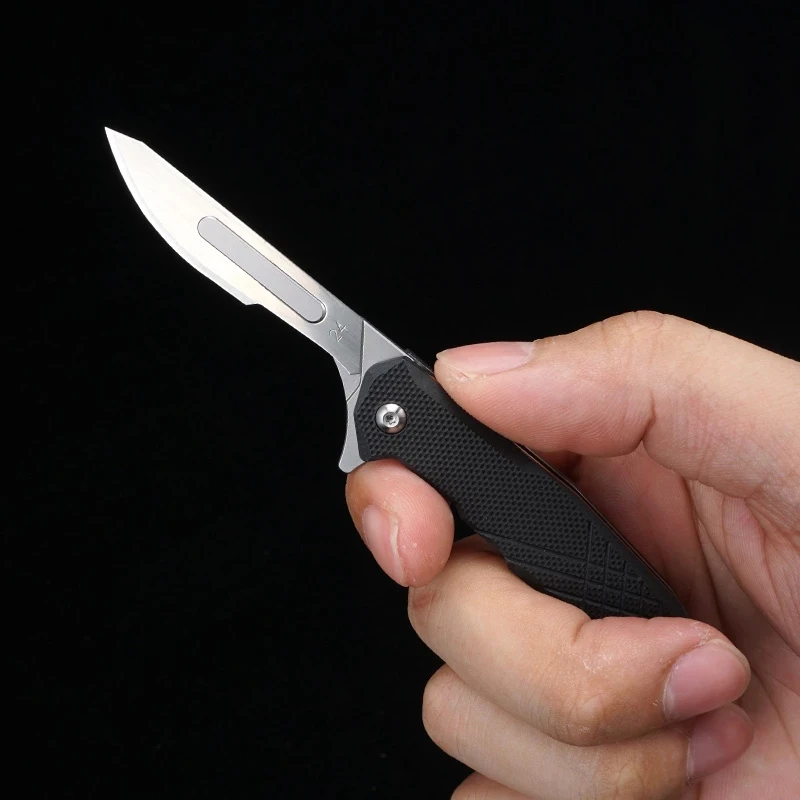 Μίνι Κραμάτων Τιτανίου G10 Νυστέρι Δίπλωμα KnifeFast Ανοίξει Ιατρική αναδιπλώστε τον αναβολέα του EDC Υπαίθρια Αποσυσκευασία Μαχαίρι Τσέπης Με 10pcs Λεπίδες