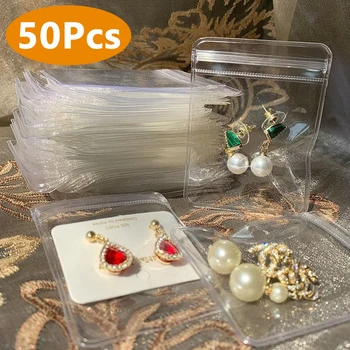 Το νέο Διαφανές PVC Διοργανωτής Κοσμήματος Τσάντες Δώρων Σκουλαρικιών Δαχτυλιδιών Αποθήκευσης Τσάντα Συσκευασίας Επίδειξης Αντι-Οξείδωση αυτοκόλλητες Σακούλες